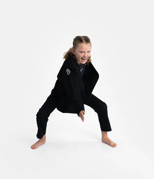 Kimono Brazilian Jiu Jitsu PROGRESS Copii Negru poza facuta din fata modelului